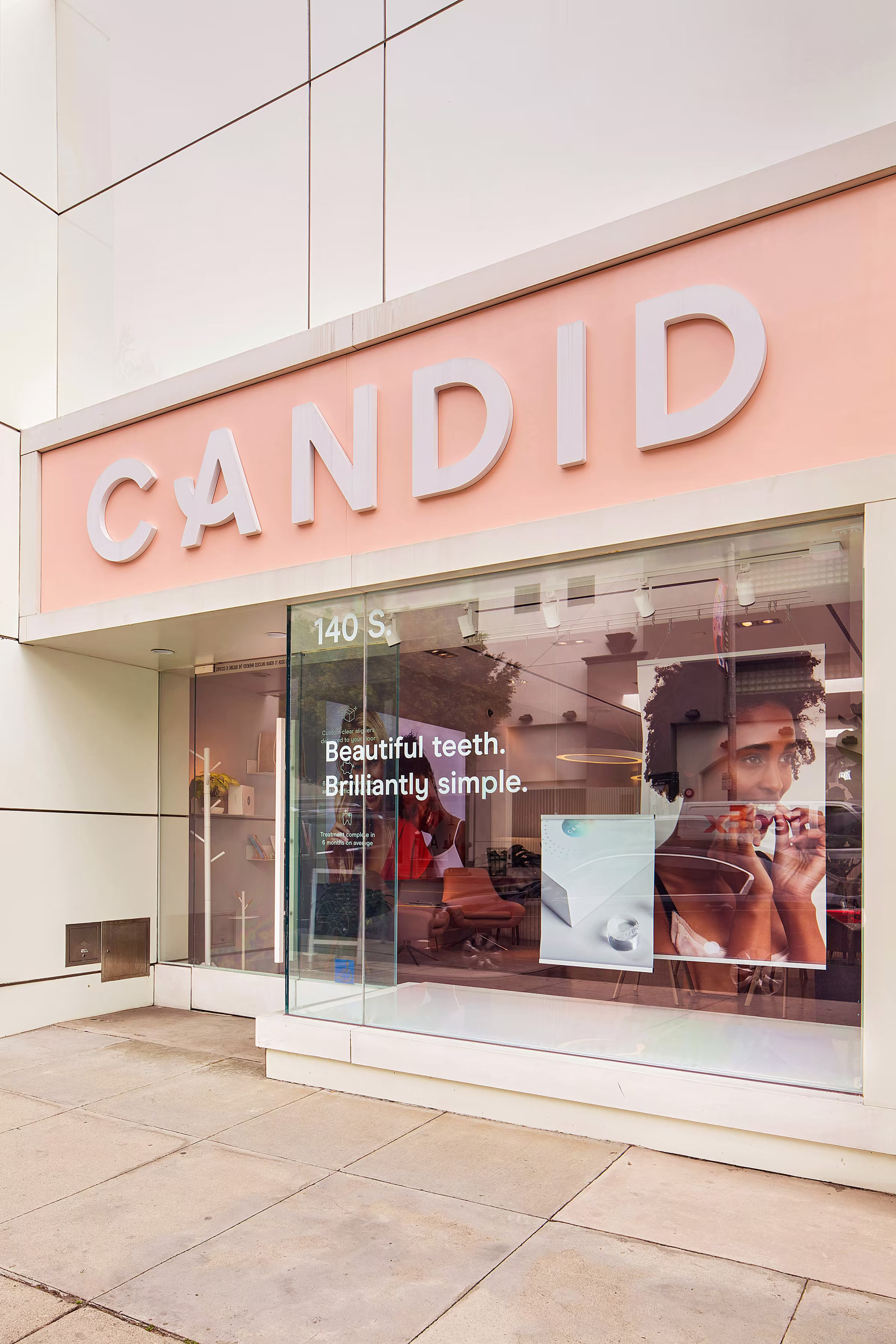 Candid storefront with dimensional letter signage